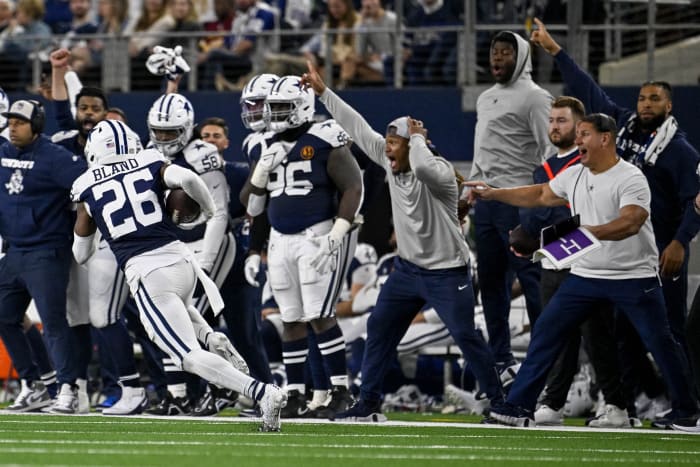 Nov 23, 2023; Arlington, Texas, USA; The Dallas Cowboys sideline reacts as cornerback DaRon Bland (26) returns an interception for a touchdown against the Washington Commanders during the second half at AT&T Stadium.